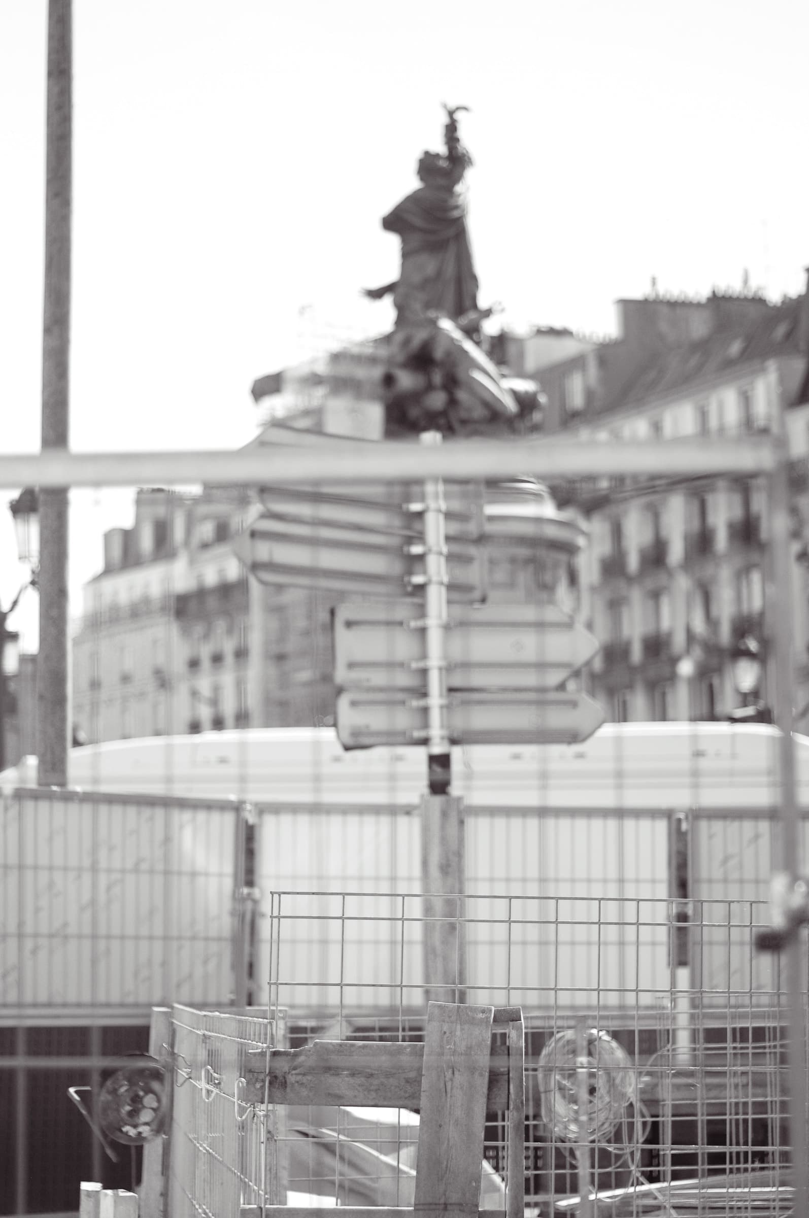 The monument seen through metal fencing around the construction site