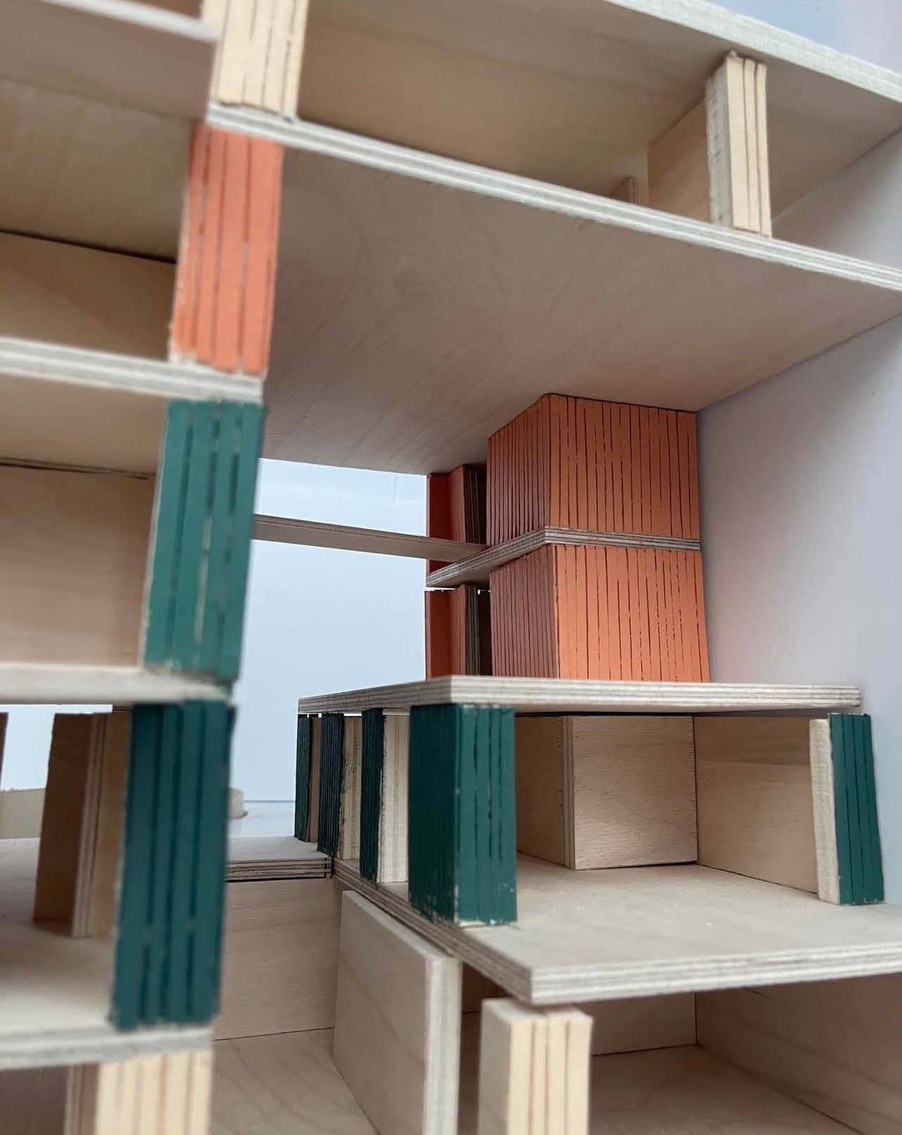 Close-up of the 1:50 model, with ribbed facade panels in green and terracotta