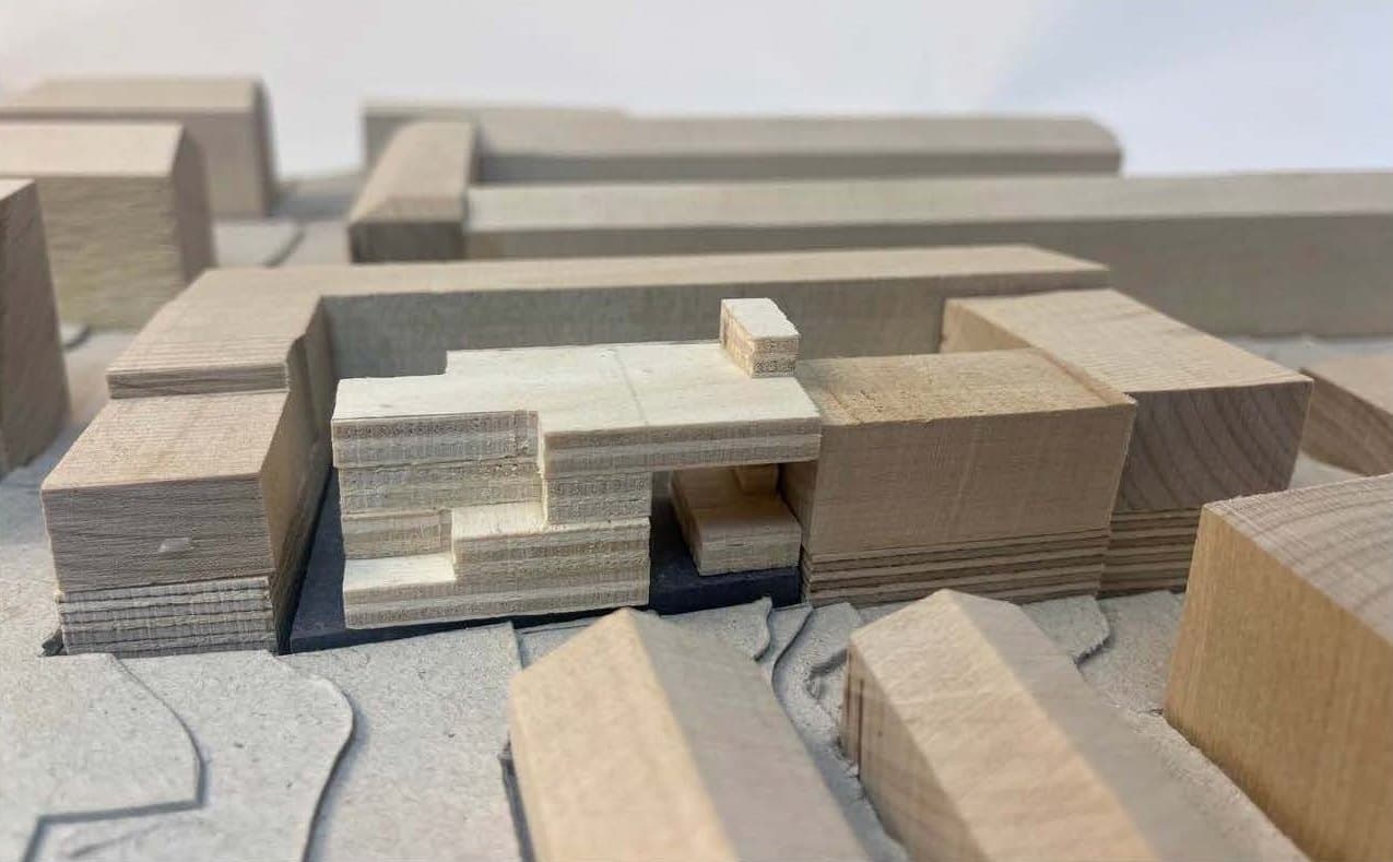 Timber site model showing the new building among the surrounding blocks